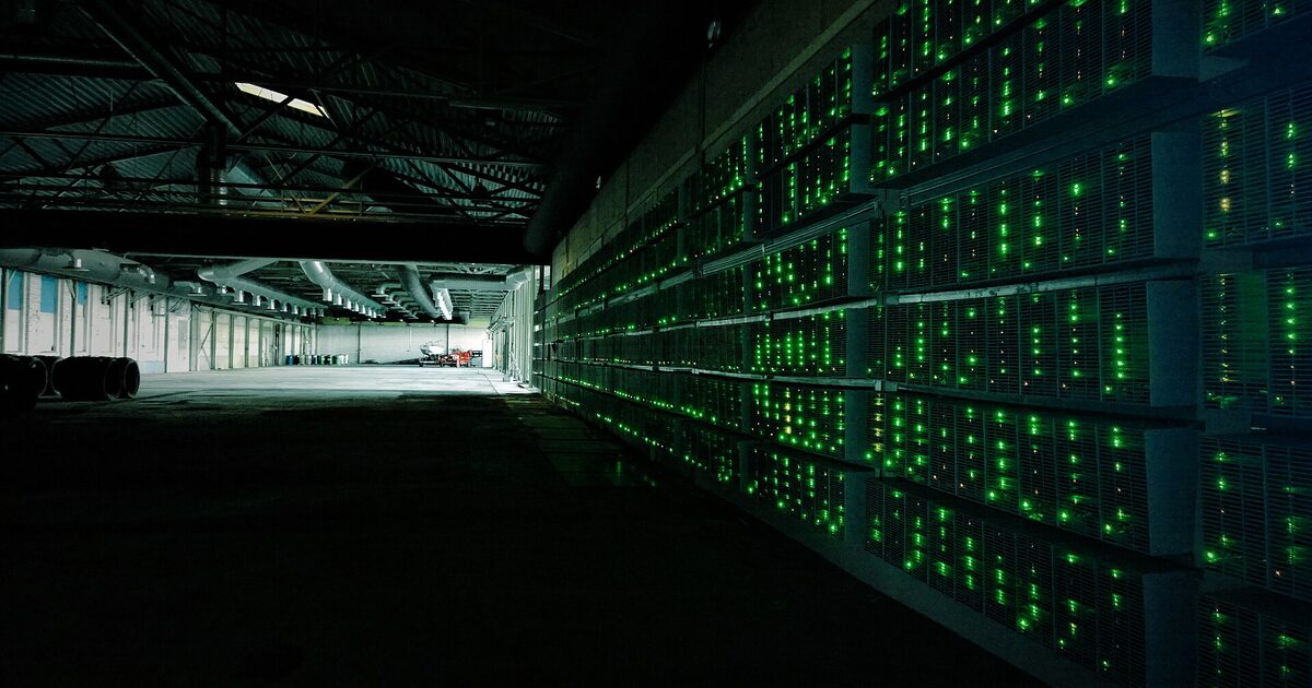 Rows of machines inside a bitcoin mining farm